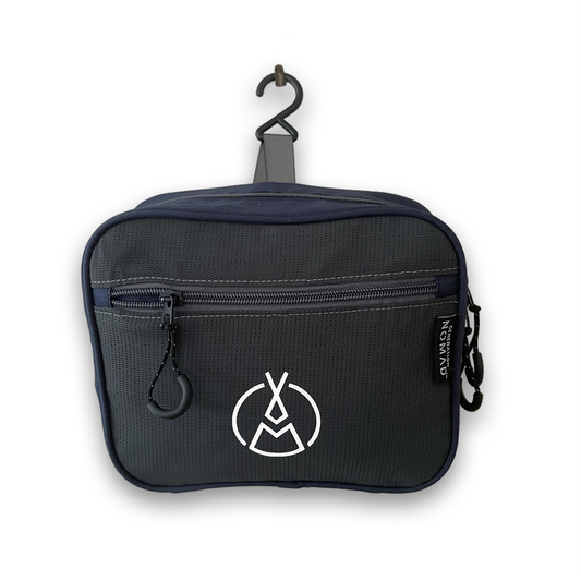 A navy blue hanging toiletry bag that is perfect for backpackers travellers because it has flexible fabric to grasp items, is customizable, and has many sections for organisation.